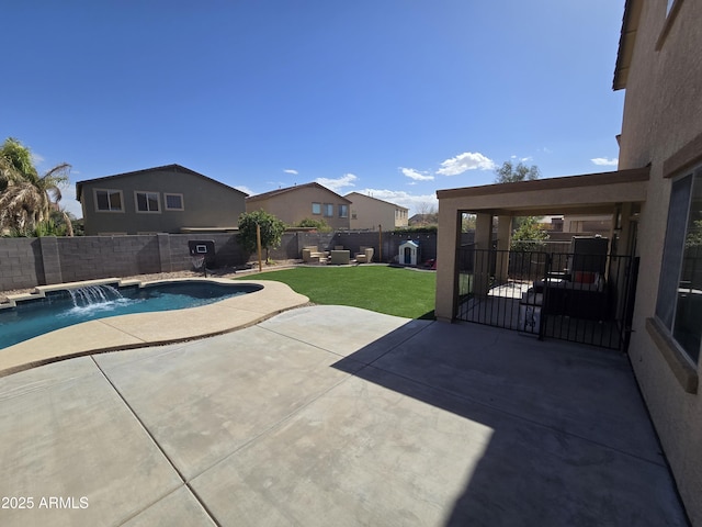 view of swimming pool featuring a patio area, a fenced backyard, a fenced in pool, and a yard