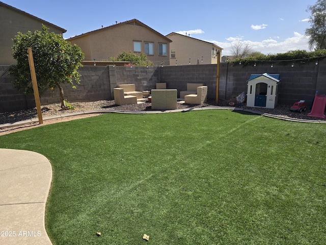 view of yard featuring a fenced backyard