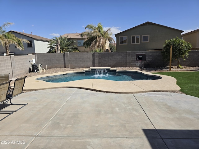 view of swimming pool featuring a fenced in pool, a fenced backyard, and a patio