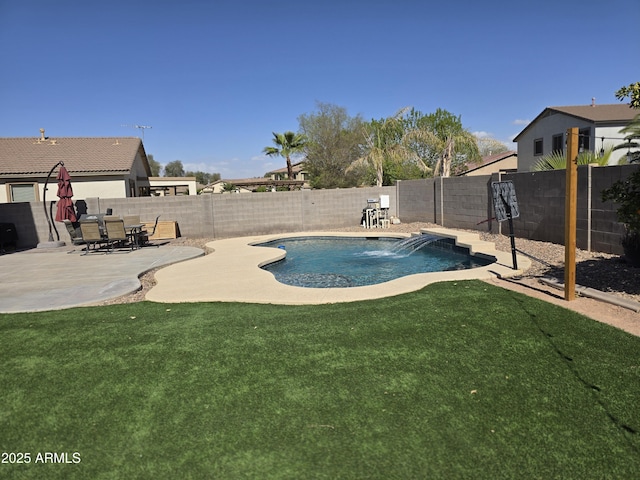 view of swimming pool with a fenced in pool, a patio area, a yard, and a fenced backyard