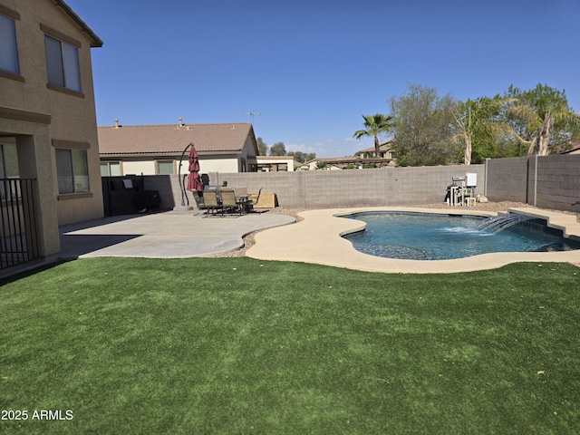 view of swimming pool featuring a fenced in pool, a fenced backyard, a patio, and a lawn