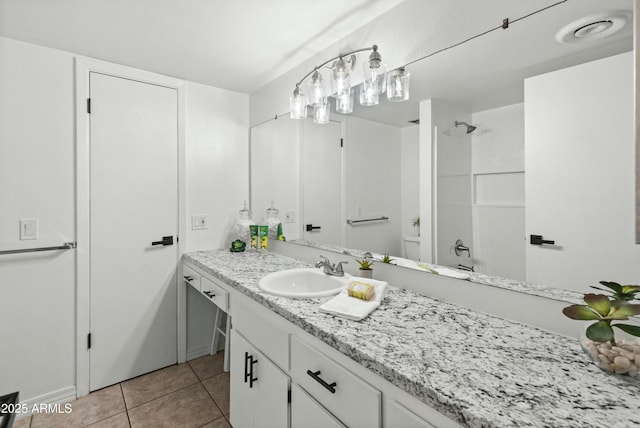 bathroom with tile patterned flooring, vanity, and shower / bathing tub combination