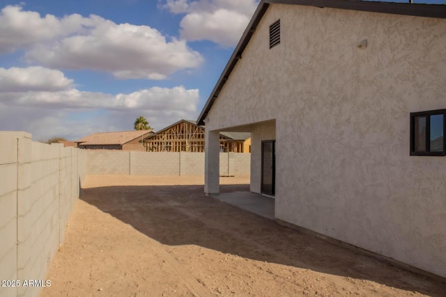 view of yard with a patio and a fenced backyard