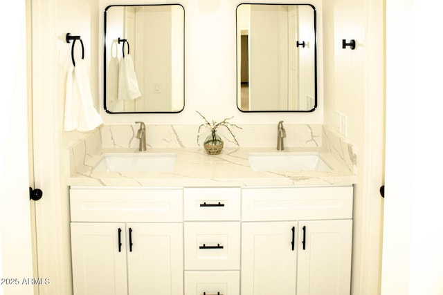 full bath with double vanity and a sink