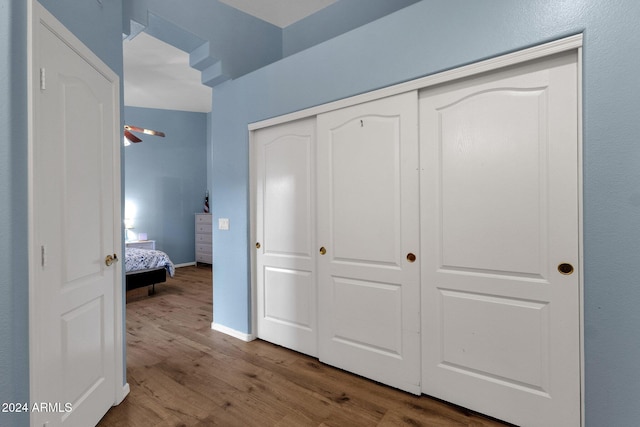 bedroom featuring hardwood / wood-style flooring and a closet