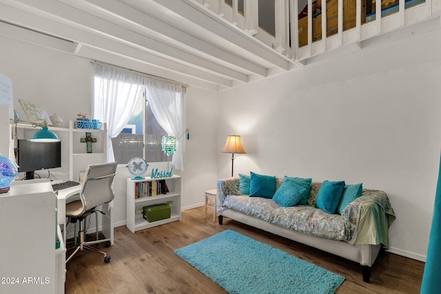 home office with hardwood / wood-style flooring