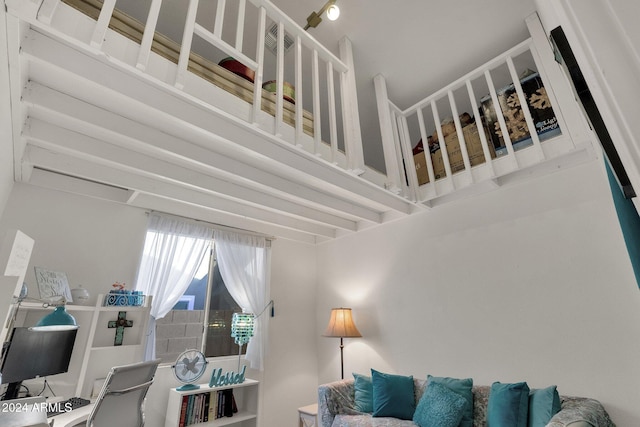 living room featuring a towering ceiling