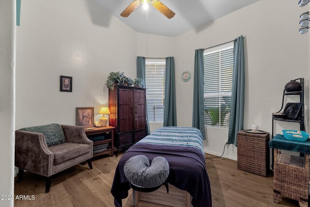 bedroom with hardwood / wood-style floors and ceiling fan