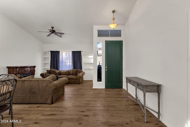 living room featuring ceiling fan, high vaulted ceiling, and dark hardwood / wood-style floors