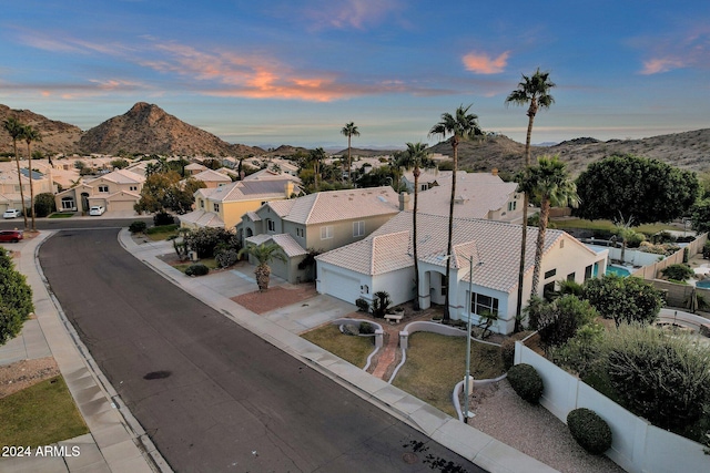 aerial view at dusk with a mountain view