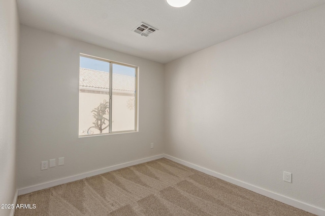 spare room featuring carpet flooring