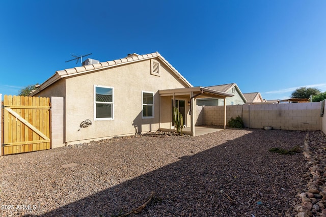 back of house featuring a patio area