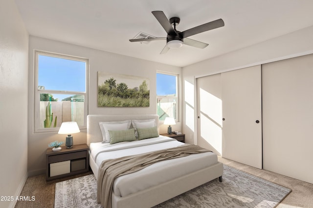 bedroom with carpet floors, a closet, and ceiling fan