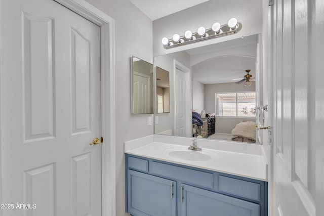 ensuite bathroom with ceiling fan, ensuite bathroom, and vanity