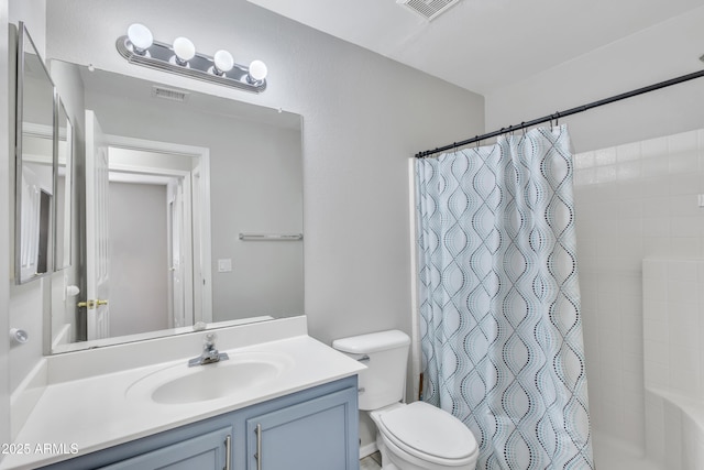 full bath featuring visible vents, toilet, and vanity