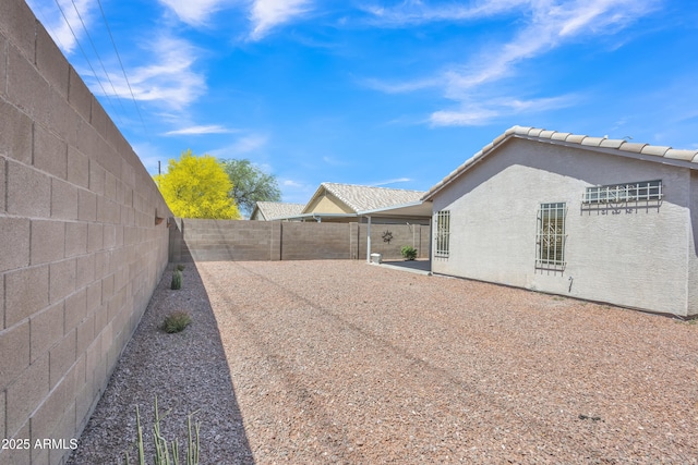 view of property exterior featuring a patio, a fenced backyard, and stucco siding