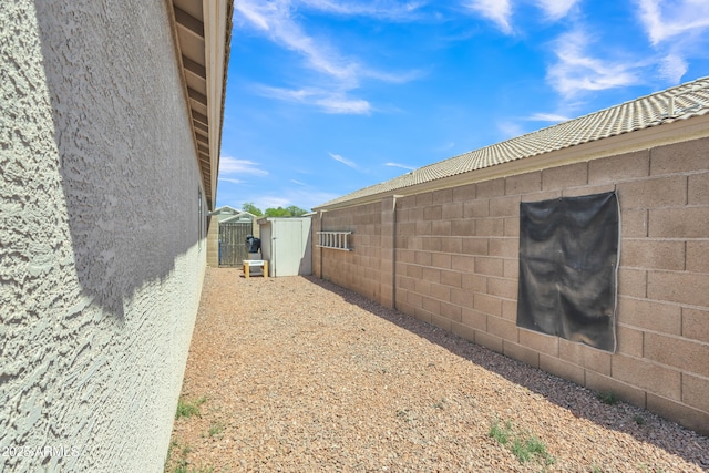 view of property exterior featuring fence
