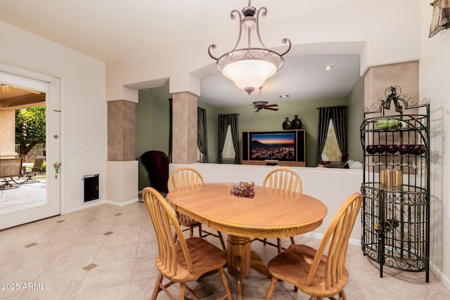 dining space with light tile patterned floors and baseboards