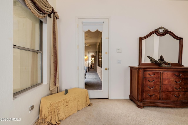 interior space with carpet and baseboards