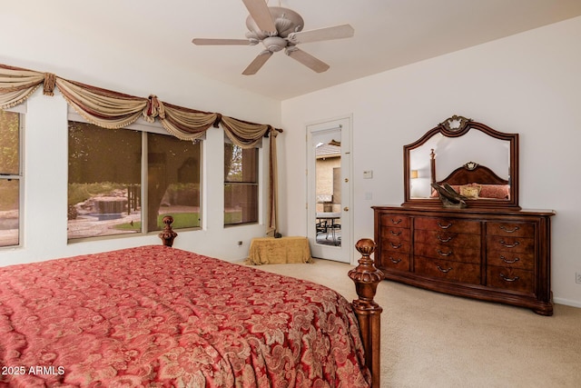 bedroom with a ceiling fan and carpet