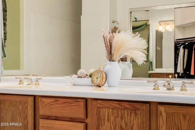 full bathroom featuring a sink and double vanity