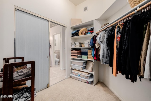 spacious closet with visible vents and carpet flooring