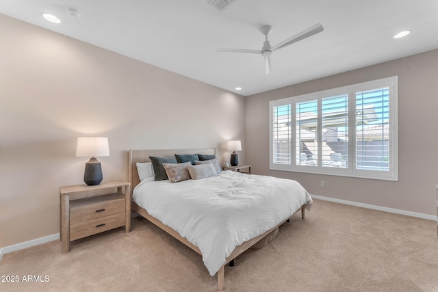 bedroom featuring ceiling fan and light colored carpet