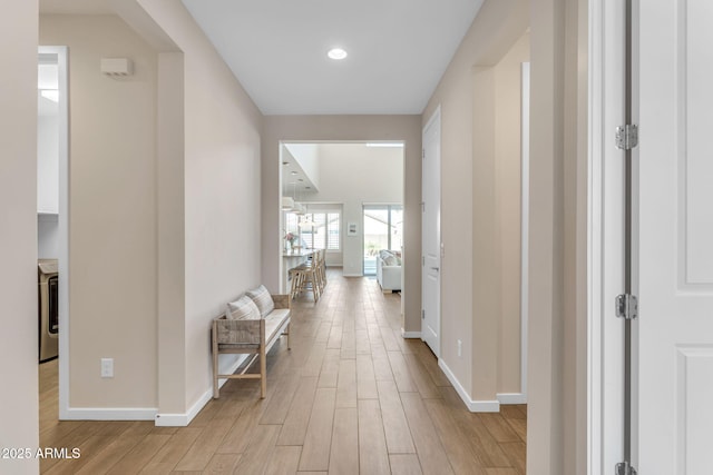 hallway with light wood-type flooring