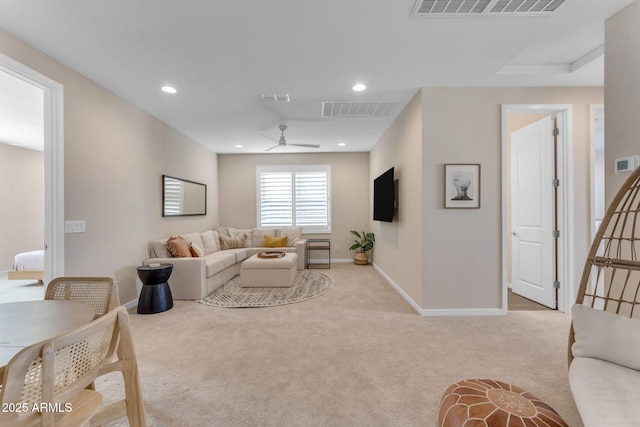 carpeted living room featuring ceiling fan