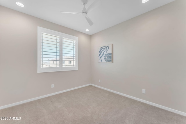 carpeted empty room featuring ceiling fan