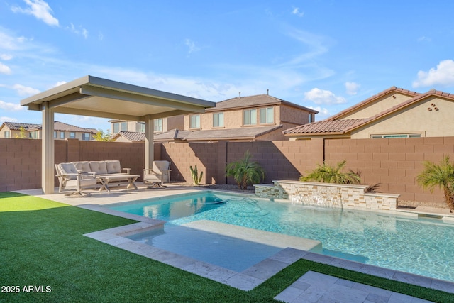 view of swimming pool featuring an outdoor living space, a yard, a patio, and pool water feature