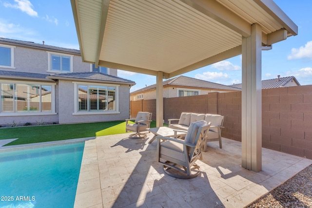 view of patio / terrace with a fenced in pool and an outdoor hangout area