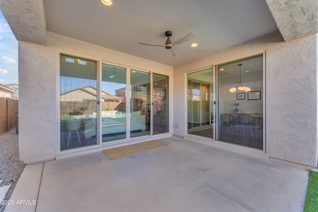 view of patio featuring ceiling fan