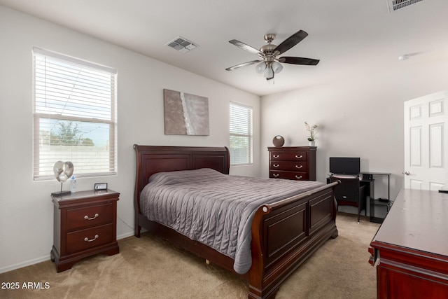 bedroom with ceiling fan and light carpet