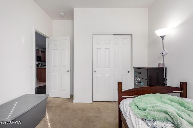 carpeted bedroom featuring a closet