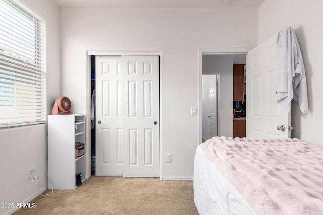 carpeted bedroom featuring a closet