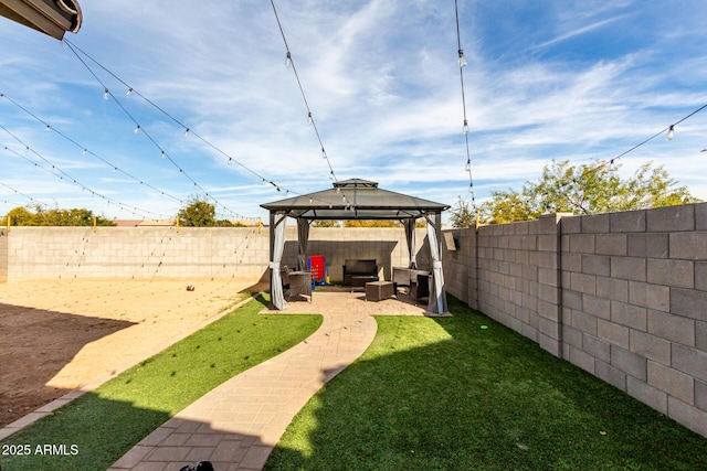 view of yard with a gazebo and a patio