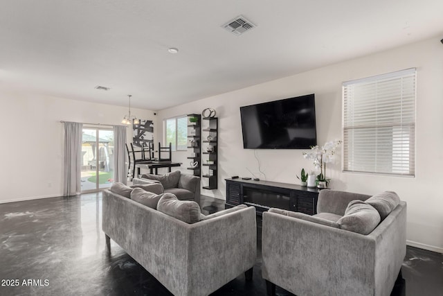 living room featuring a notable chandelier