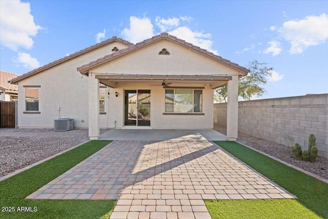 rear view of property featuring a patio, cooling unit, and ceiling fan