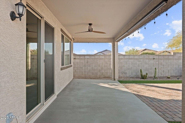 view of patio featuring ceiling fan