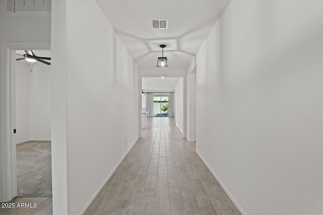 corridor featuring light hardwood / wood-style flooring