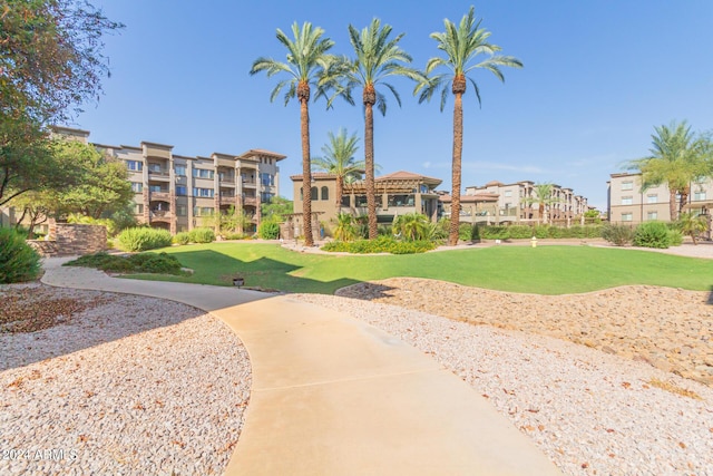 view of home's community featuring a lawn