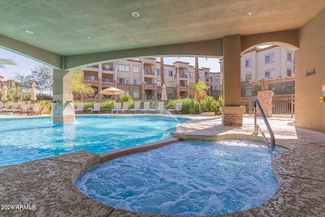 view of swimming pool featuring pool water feature