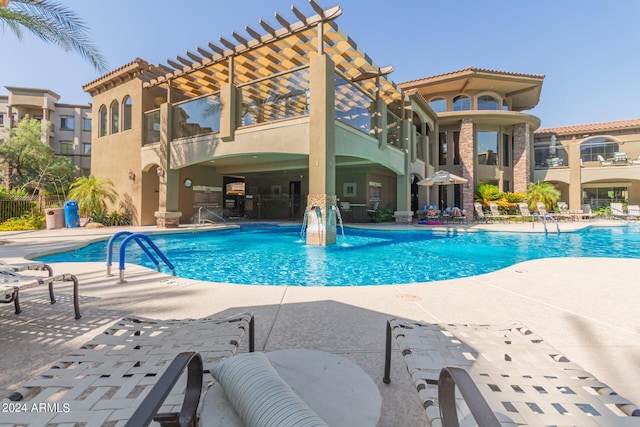 view of pool featuring a patio area and pool water feature