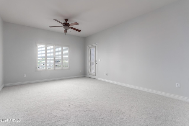 unfurnished room with ceiling fan and light carpet