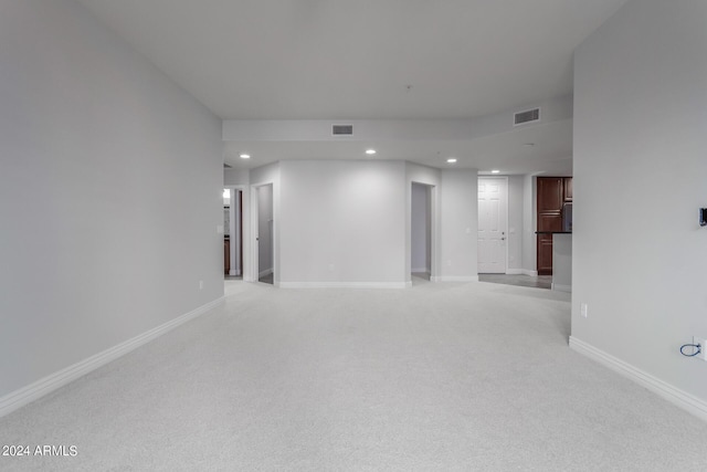 empty room featuring light colored carpet