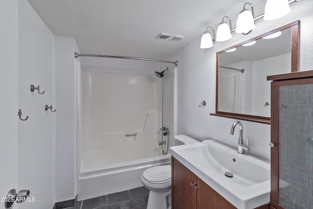 full bathroom featuring tile patterned floors, toilet, a textured ceiling, vanity, and shower / bath combination