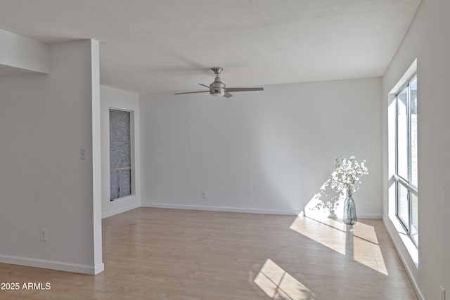 spare room featuring ceiling fan and light wood-type flooring