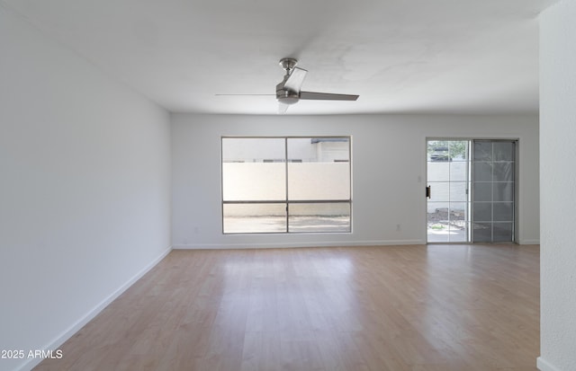 unfurnished room featuring ceiling fan and light wood-type flooring