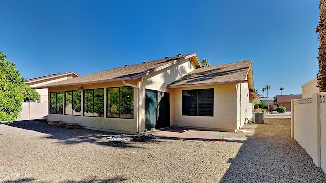 back of property featuring central AC and a patio area